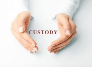 female hands word custody x How Does Child Support Affect Custody?